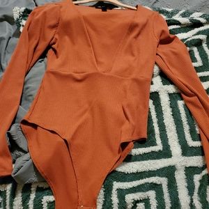 Soft orange body suit